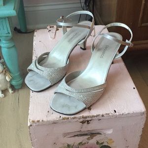 Silver dressy heeled sandals with heeled details
